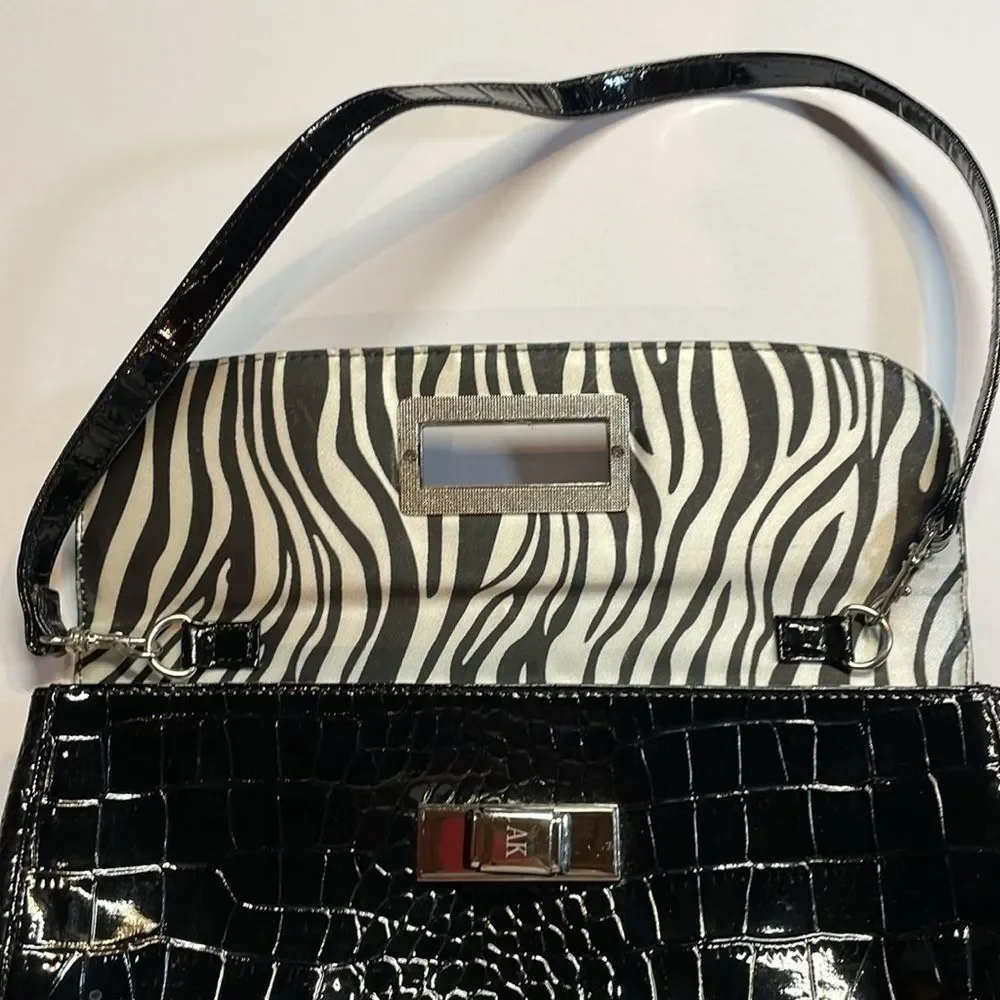 Anne Klein woman’s black handbag/purse/clutch style zebra pattern interior